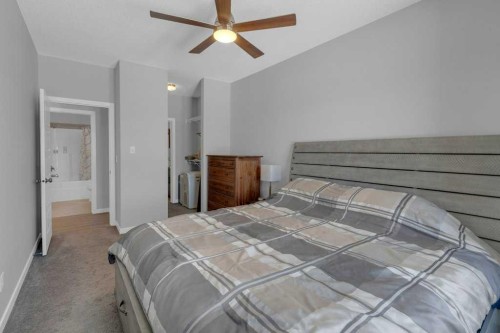 207-207 Sunset Drive, Cochrane, AB - Indoor Photo Showing Bedroom