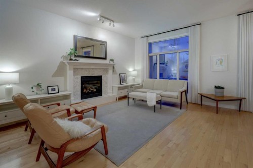 57 Discovery Ridge Hill Sw, Calgary, AB - Indoor Photo Showing Living Room With Fireplace