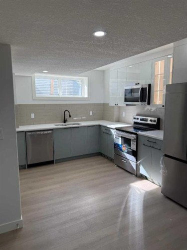 455 Tekarra Drive Nw, Calgary, AB - Indoor Photo Showing Kitchen With Stainless Steel Kitchen With Upgraded Kitchen