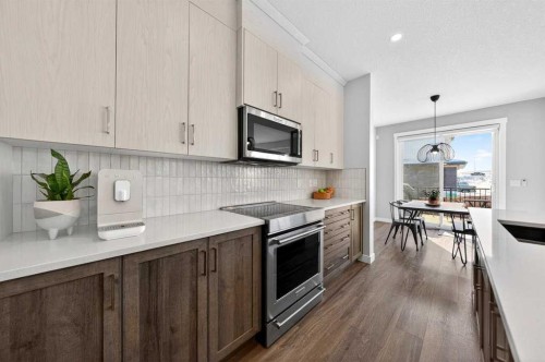 23 Willow Park Point, Cochrane, AB - Indoor Photo Showing Kitchen With Upgraded Kitchen