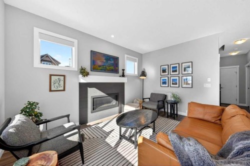 23 Willow Park Point, Cochrane, AB - Indoor Photo Showing Living Room With Fireplace
