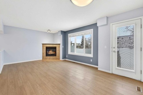 11 Chaparral Ridge Terrace Se, Calgary, AB - Indoor Photo Showing Living Room With Fireplace