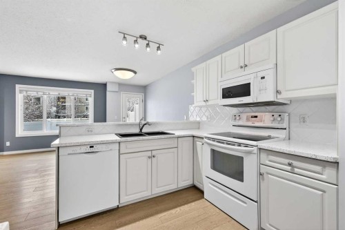 11 Chaparral Ridge Terrace Se, Calgary, AB - Indoor Photo Showing Kitchen With Double Sink