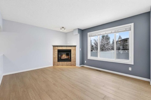 11 Chaparral Ridge Terrace Se, Calgary, AB - Indoor Photo Showing Living Room With Fireplace