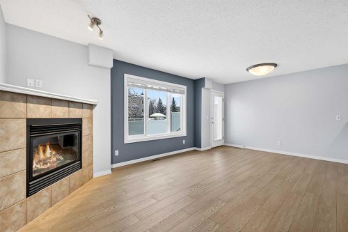 11 Chaparral Ridge Terrace Se, Calgary, AB - Indoor Photo Showing Living Room With Fireplace