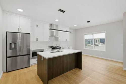 9 Bayview Mews Sw, Airdrie, AB - Indoor Photo Showing Kitchen With Upgraded Kitchen