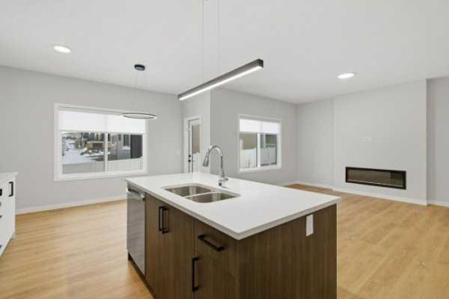 9 Bayview Mews Sw, Airdrie, AB - Indoor Photo Showing Kitchen With Double Sink