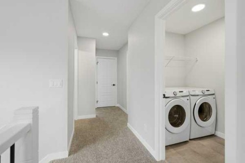 9 Bayview Mews Sw, Airdrie, AB - Indoor Photo Showing Laundry Room
