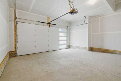 9 Bayview Mews Sw, Airdrie, AB - Indoor Photo Showing Garage