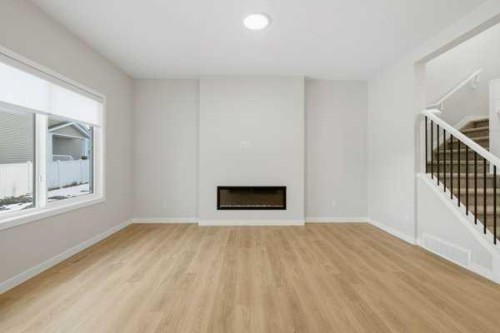 9 Bayview Mews Sw, Airdrie, AB - Indoor With Fireplace