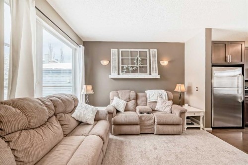 63 Chapalina Square Se, Calgary, AB - Indoor Photo Showing Living Room