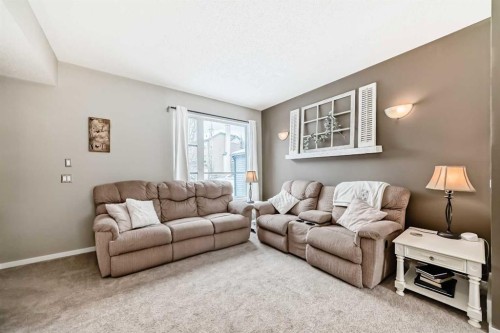 63 Chapalina Square Se, Calgary, AB - Indoor Photo Showing Living Room