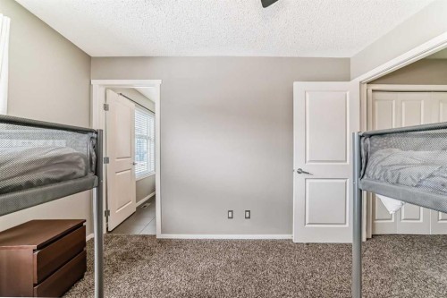 63 Chapalina Square Se, Calgary, AB - Indoor Photo Showing Bedroom