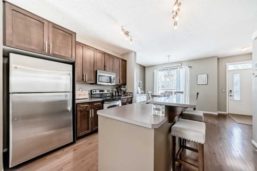 63 Chapalina Square Se, Calgary, AB - Indoor Photo Showing Kitchen With Stainless Steel Kitchen