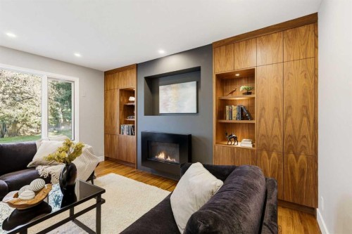 723 Willamette Drive Se, Calgary, AB - Indoor Photo Showing Living Room With Fireplace