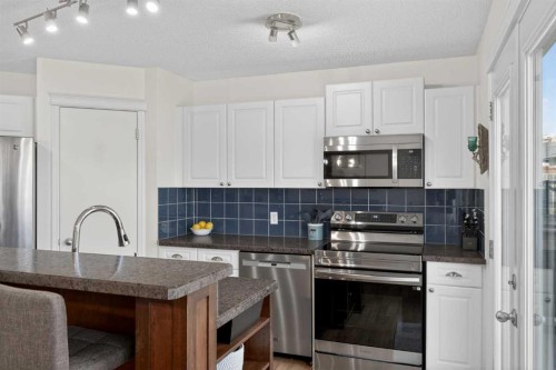 54 Tuscany Valley Rise Nw, Calgary, AB - Indoor Photo Showing Kitchen With Upgraded Kitchen