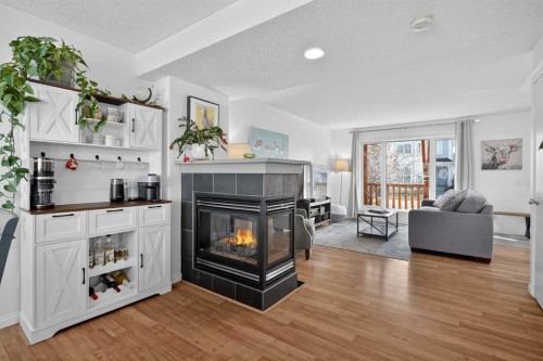 54 Tuscany Valley Rise Nw, Calgary, AB - Indoor Photo Showing Living Room With Fireplace