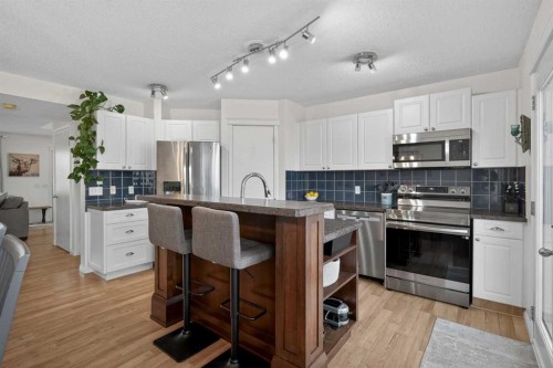 54 Tuscany Valley Rise Nw, Calgary, AB - Indoor Photo Showing Kitchen With Upgraded Kitchen