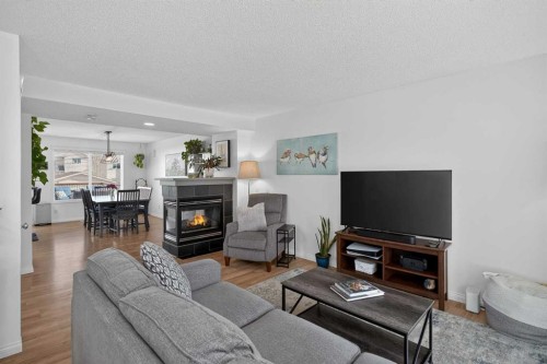 54 Tuscany Valley Rise Nw, Calgary, AB - Indoor Photo Showing Living Room With Fireplace
