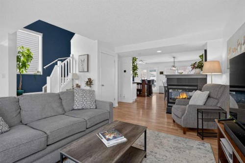 54 Tuscany Valley Rise Nw, Calgary, AB - Indoor Photo Showing Living Room With Fireplace