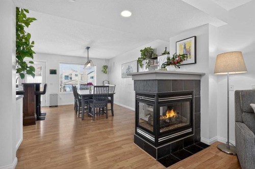 54 Tuscany Valley Rise Nw, Calgary, AB - Indoor Photo Showing Other Room With Fireplace