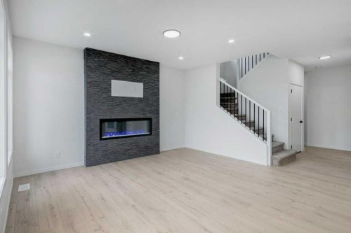 370 Corner Glen Way Ne, Calgary, AB - Indoor Photo Showing Living Room With Fireplace