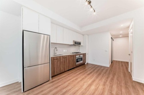 1313-730 2 Avenue, Calgary, AB - Indoor Photo Showing Kitchen With Stainless Steel Kitchen