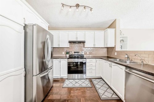 67 Bridleglen Manor Sw, Calgary, AB - Indoor Photo Showing Kitchen With Stainless Steel Kitchen With Double Sink