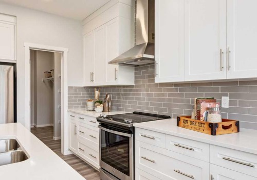 133 Versant Rise Sw, Calgary, AB - Indoor Photo Showing Kitchen With Double Sink With Upgraded Kitchen