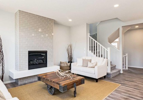 133 Versant Rise Sw, Calgary, AB - Indoor Photo Showing Living Room With Fireplace