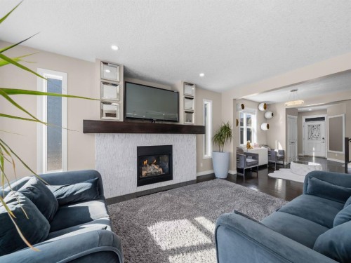 91 Silverado Ridge Crescent Sw, Calgary, AB - Indoor Photo Showing Living Room With Fireplace