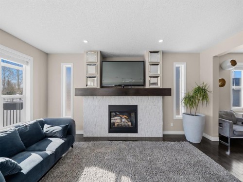 91 Silverado Ridge Crescent Sw, Calgary, AB - Indoor Photo Showing Living Room With Fireplace