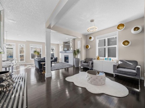91 Silverado Ridge Crescent Sw, Calgary, AB - Indoor Photo Showing Living Room With Fireplace