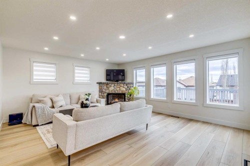 447 Tuscany Ridge Heights Nw, Calgary, AB - Indoor Photo Showing Living Room With Fireplace