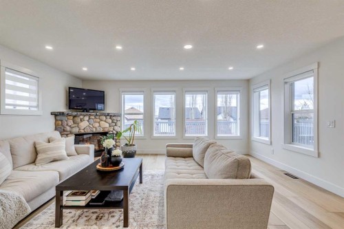 447 Tuscany Ridge Heights Nw, Calgary, AB - Indoor Photo Showing Living Room With Fireplace