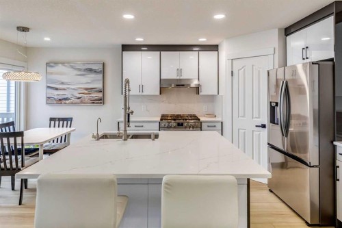 447 Tuscany Ridge Heights Nw, Calgary, AB - Indoor Photo Showing Kitchen With Double Sink With Upgraded Kitchen