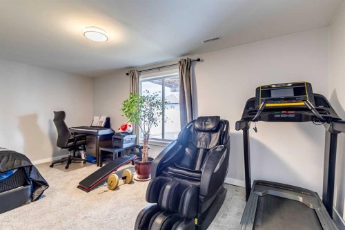 447 Tuscany Ridge Heights Nw, Calgary, AB - Indoor Photo Showing Gym Room