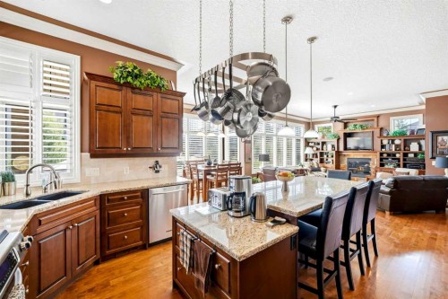21 Evergreen Row Sw, Calgary, AB - Indoor Photo Showing Kitchen With Double Sink With Upgraded Kitchen