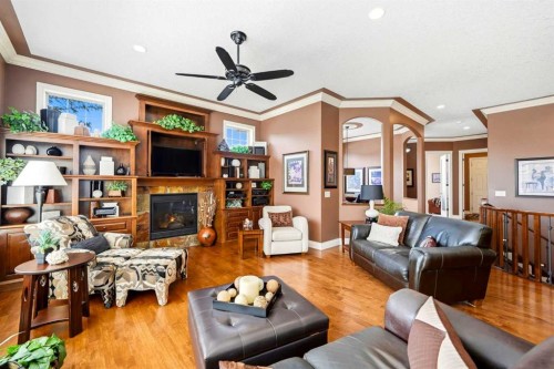 21 Evergreen Row Sw, Calgary, AB - Indoor Photo Showing Living Room With Fireplace