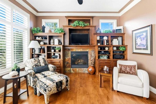 21 Evergreen Row Sw, Calgary, AB - Indoor Photo Showing Living Room With Fireplace