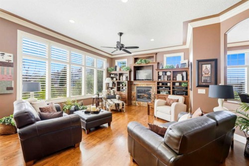 21 Evergreen Row Sw, Calgary, AB - Indoor Photo Showing Living Room With Fireplace