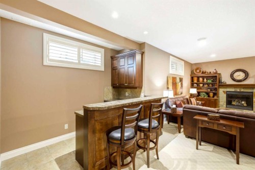 21 Evergreen Row Sw, Calgary, AB - Indoor With Fireplace