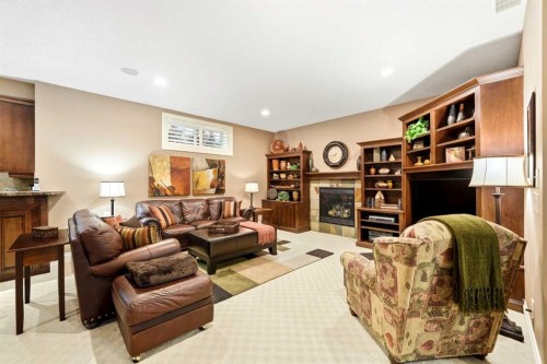 21 Evergreen Row Sw, Calgary, AB - Indoor With Fireplace