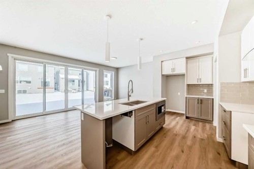 53 Bartlett Way Se, Calgary, AB - Indoor Photo Showing Kitchen With Double Sink With Upgraded Kitchen