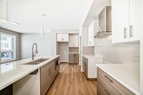 53 Bartlett Way Se, Calgary, AB - Indoor Photo Showing Kitchen With Double Sink With Upgraded Kitchen