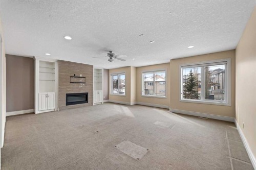 28 Panatella Manor Nw, Calgary, AB - Indoor With Fireplace