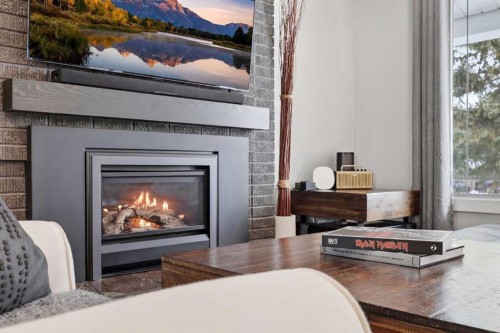 1015 Maplecroft Road Se, Calgary, AB - Indoor Photo Showing Living Room With Fireplace