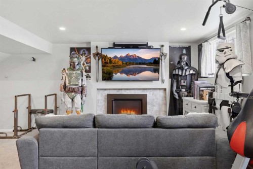 1015 Maplecroft Road Se, Calgary, AB - Indoor Photo Showing Living Room With Fireplace