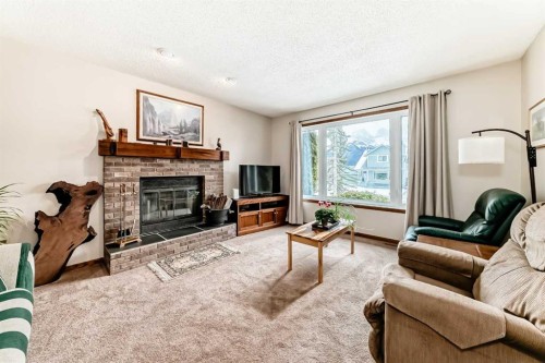 104 Kodiak Road, Canmore, AB - Indoor Photo Showing Living Room With Fireplace