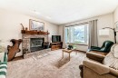 104 Kodiak Road, Canmore, AB  - Indoor Photo Showing Living Room With Fireplace 